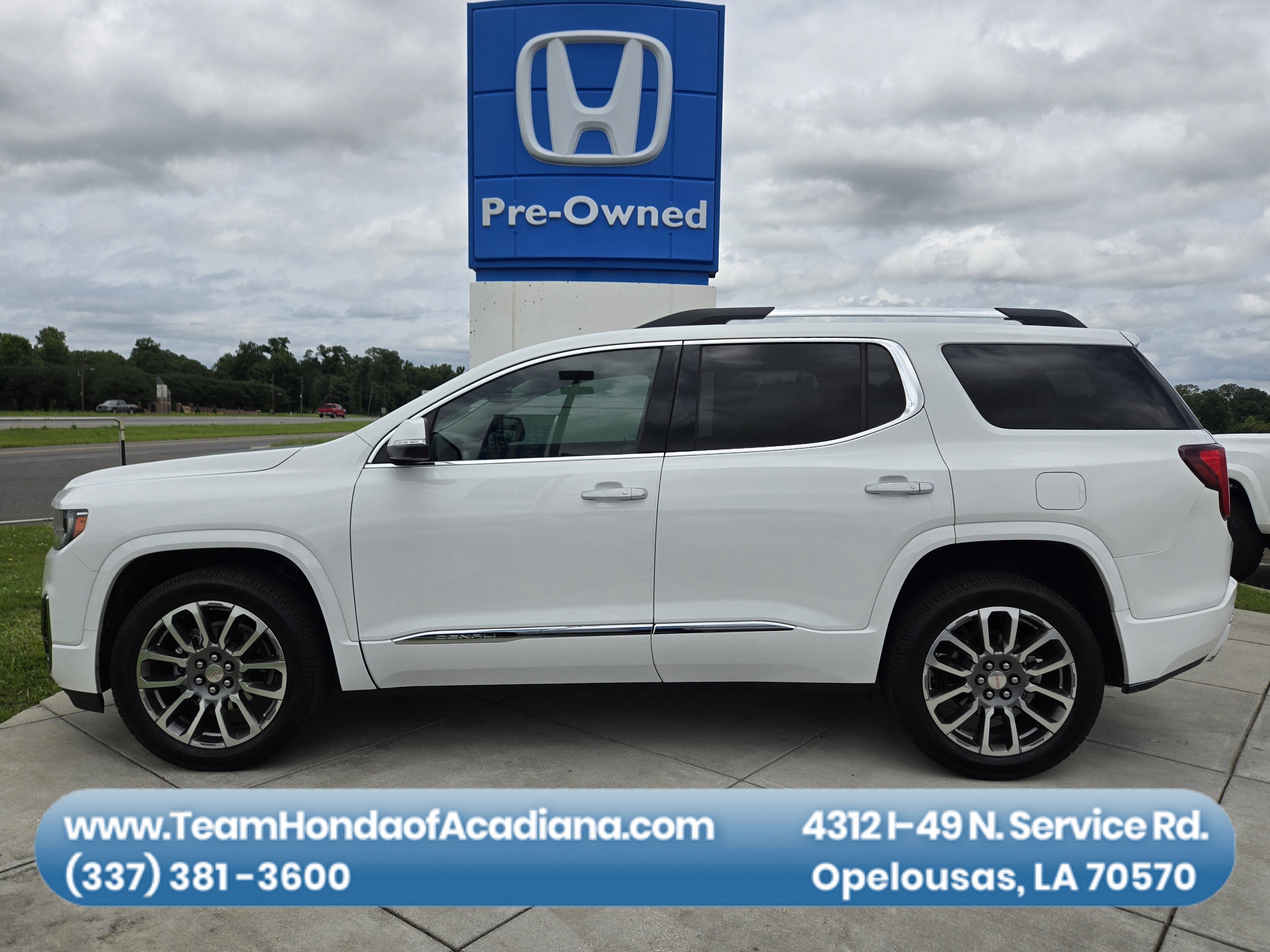 2021 GMC Acadia Denali in Summit White — front three-quarter view